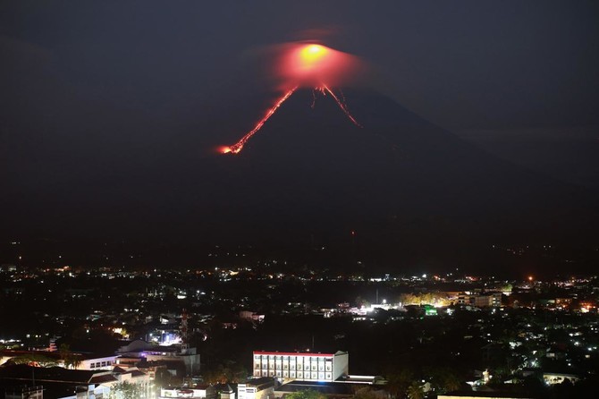 Philippine volcano ‘fireworks’ draw tourists as residents flee