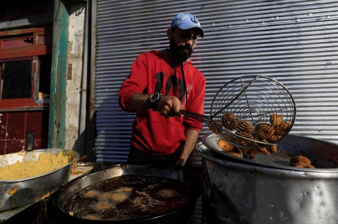 At beloved falafel shop, Syrians get taste of pre-war Raqqa | Arab News