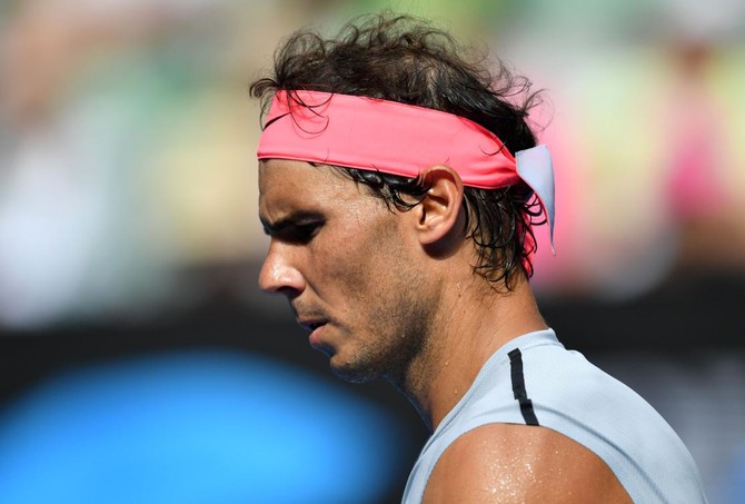 Relieved Rafa Nadal survives test as Caroline Wozniacki turns on style