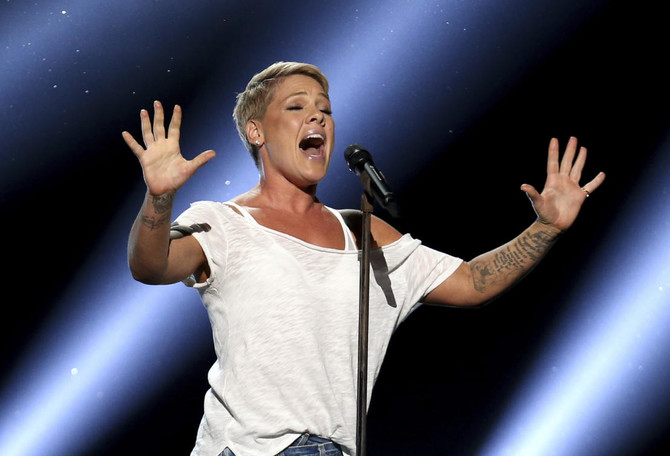 With the flu, Pink powers through pre-Super Bowl concert