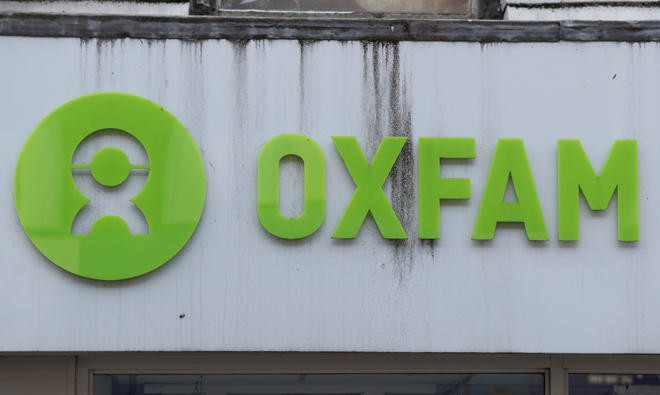 UK threatens to cut off aid cash to charities after Oxfam sex report