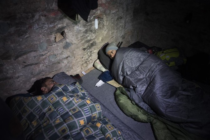 Migrants on stalled route hide in Greek city’s ancient walls