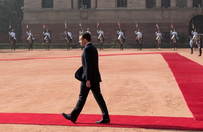 French president pokes at Trump for leaving Paris accord