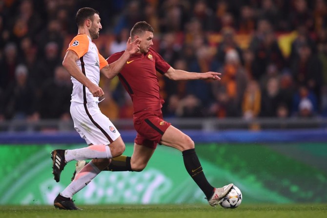 Dzeko strikes to take Roma into Champions League last eight