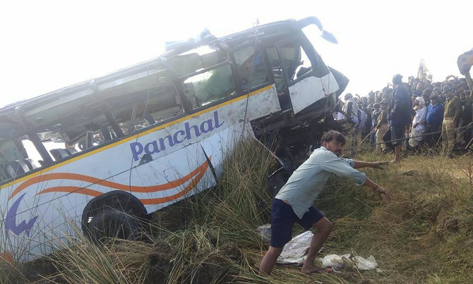 Bus falls into dry river bed in east India, killing 12