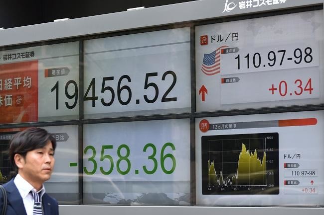 Asian markets tumble with Wall St. as Facebook breach hits tech