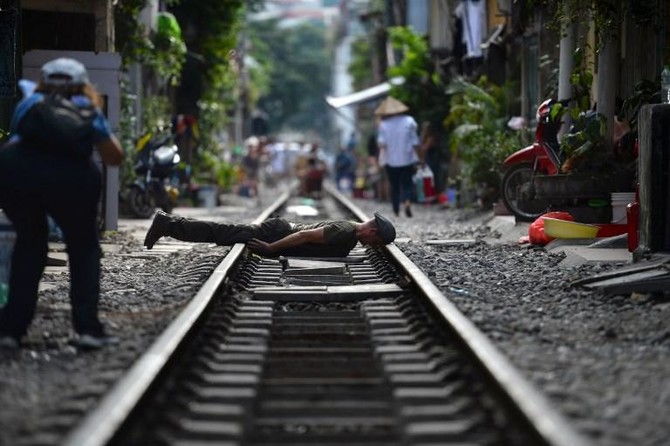 Boy posing on railway track - PixaHive