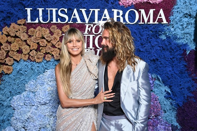 Heidi Klum, Chrissy Teigen dazzle in Mideast gowns on Italian red ...