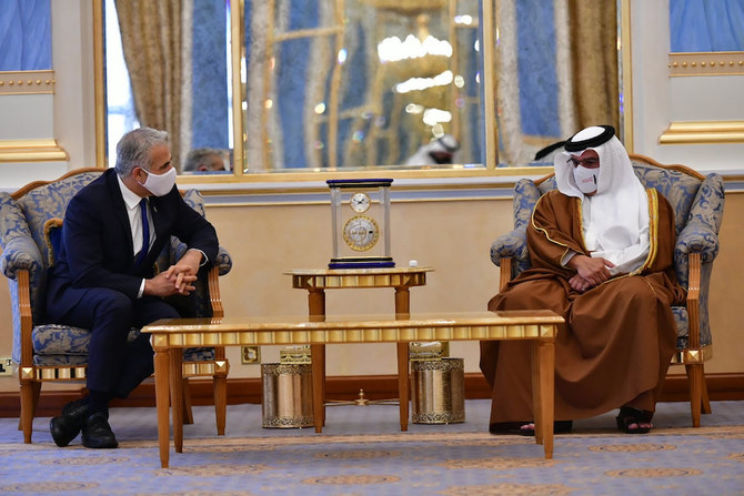 Bahrain’s Crown Prince Salman bin Hamad meets Israel’s Foreign Minister Yair Lapid in Manama, Bahrain, Thursday, Sept. 30, 2021. (Israeli Government Press Office via AP)