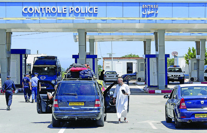 Cars cross at the northwestern Tunisian Tabarka border post on the first day of its reopening on Friday after more than two years of closure due to the COVID-19 pandemic. (AFP)