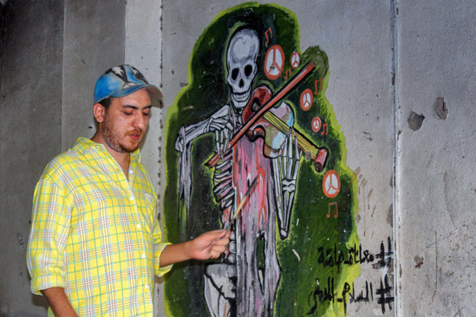 Yemen street artist chronicles war on battle-scarred walls | Arab News