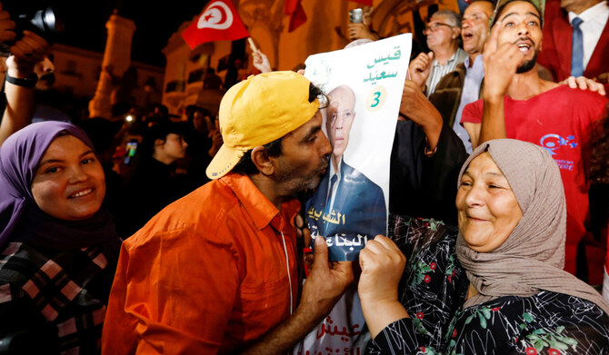 Supporters of Tunisian President Kais Saied, celebrate as exit poll shows Saied won the presidential election in Tunis, Tunisia October 6, 2024. (REUTERS)