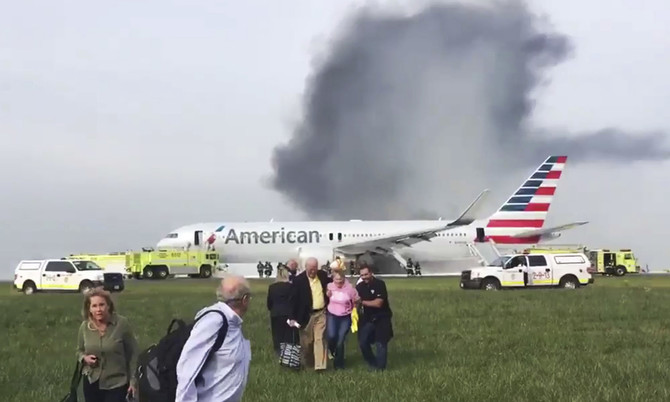 Passenger plane evacuated as it catches fire at Chicago airport