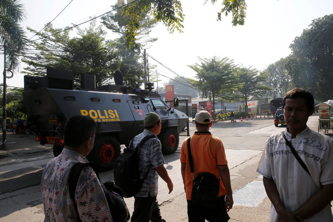 Detainees, officers hurt in Indonesia detention center riot