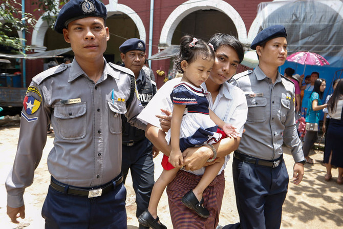 Reuters reporter says Myanmar police planted “secret” papers