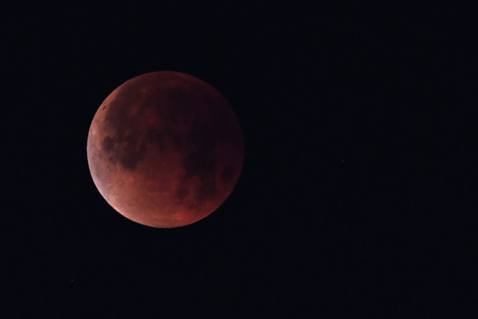 Red planet and ‘blood moon’ pair up to dazzle skygazers