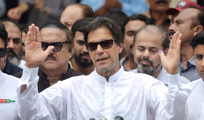 Imran Khan takes firm lead in Pakistani election marred by violence and rigging claims