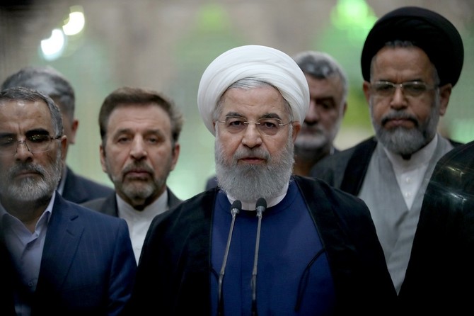 Iran’s Rouhani under attack from all sides