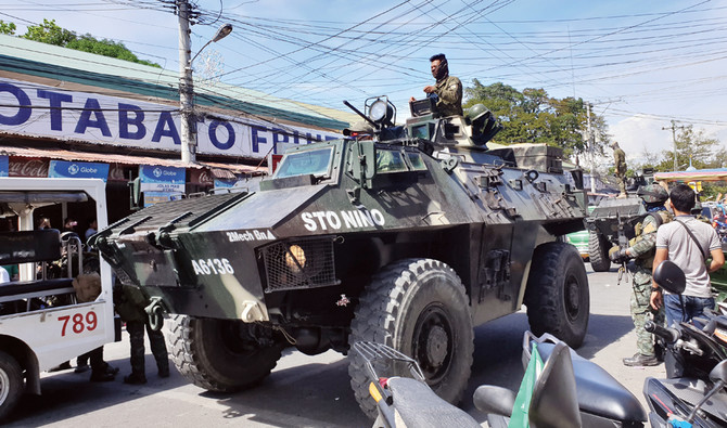 Leader of Philippines separatist group casts vote in historic referendum