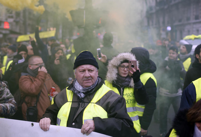 ‘Yellow vests’ back on France’s streets to challenge Macron