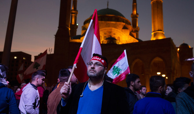 Thousands protest against new PM, close roads in Lebanon