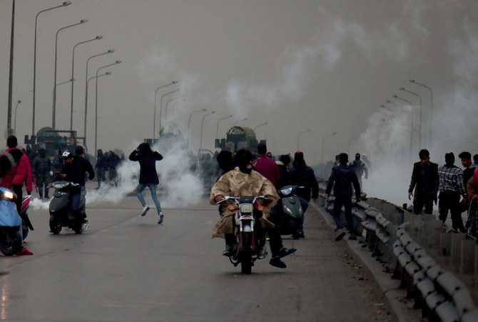 Iraq activist shot dead as anti-government protesters block roads