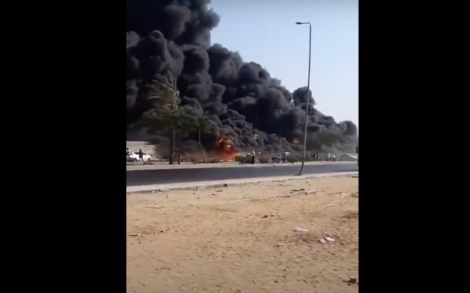 Firefighters battle huge fire at major Cairo highway, 12 injuries reported