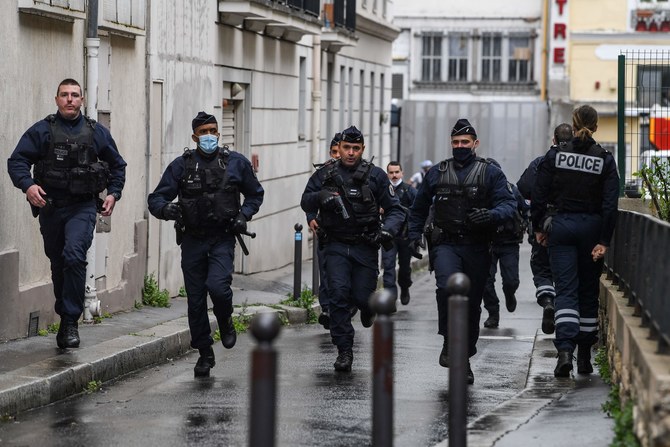 Man held on terror charges after two wounded in Paris cleaver attack