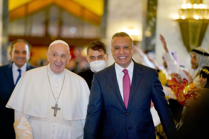 Pope Francis greeted by Iraq prime minister Mustafa Al-Kadhimi are greeted by traditional dancing shortly after the pontiff's arrival in Iraq. (@IraqiPMO)