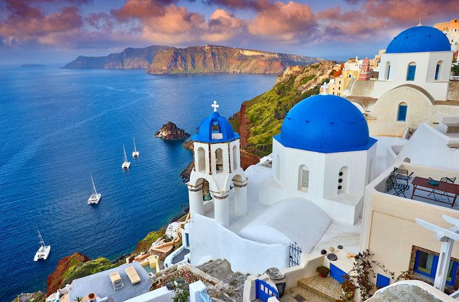 The picture-perfect island of Santorini, with its proliferation of blue-domed buildings, is a honeymooners’ favorite. (Shutterstock)