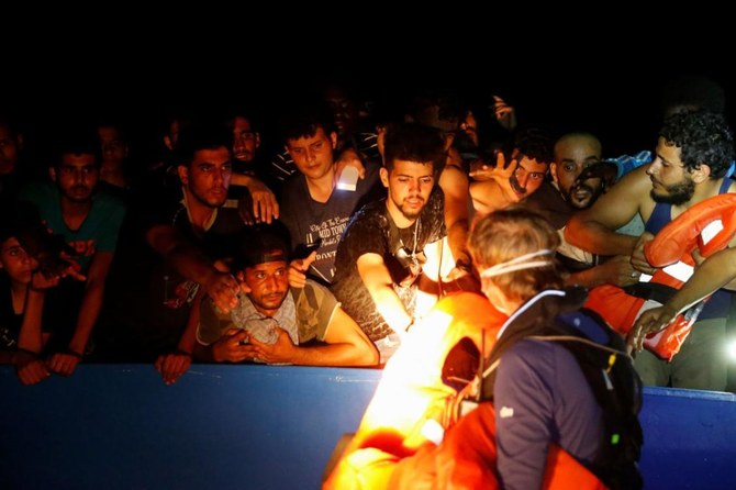 Rescuers pull 394 migrants from dangerously overcrowded boat off Tunisia