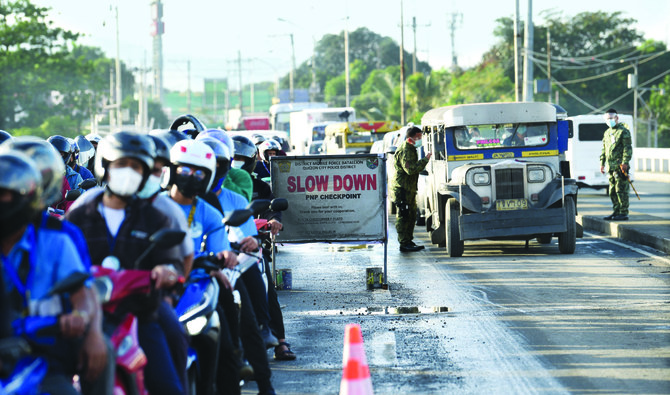 Thousands of police swarm Manila streets as strict lockdown takes effect