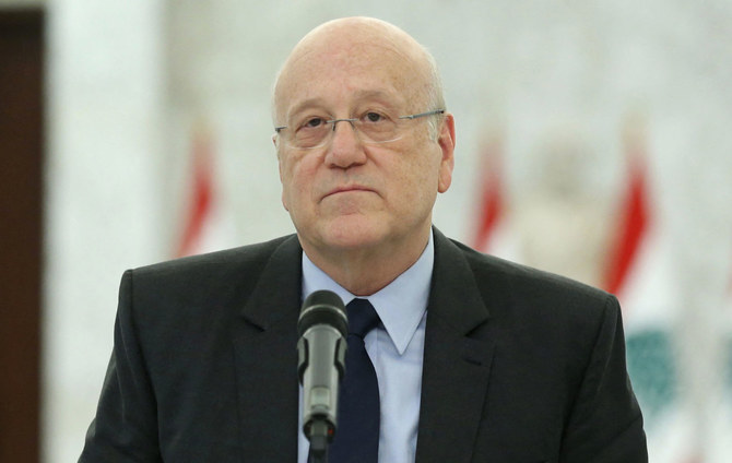 Lebanon's premier-designate Najib Mikati holding a press conference following his meeting with the president at the presidential palace in Baabda, east of the capital Beirut, on August 16 26, 2021. (AFP)