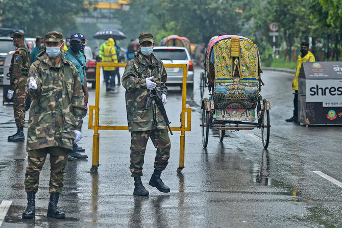 A court in Bangladesh’s capital Dhaka accepted formal charges laid out by police under the Digital Security Act against cartoonist Ahmed Kabir Kishore and rights activist and journalist Tasneem Khalil. (File/AFP)