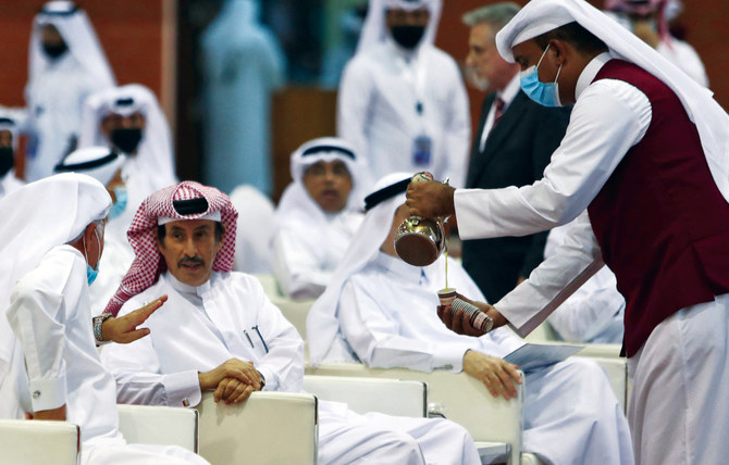 Red carpet, prayers and kisses as Qataris go to the polls