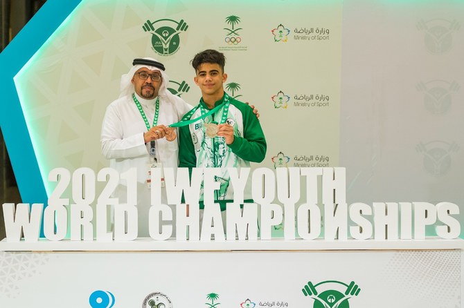 Ali Majed celebrates Mohammed Al-Hardi, President of the Saudi Arabian Weightlifting Federation. (Supplied/SAWF)