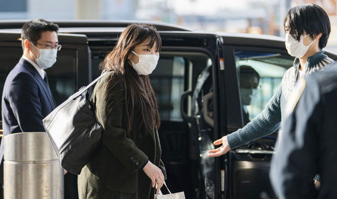 Mako Komuro, former Princess Mako, and Kei Komuro, right, arrive at John F. Kennedy International Airport in the Queens borough of New York Sunday, Nov. 14, 2021. (AP)