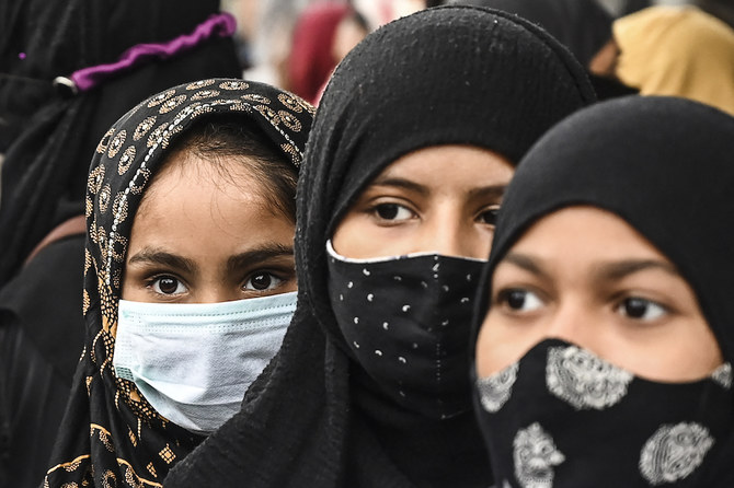 Muslim women take part in a protest against the recent hijab ban in few educational institutes of Karnataka state, in Kolkata. (AFP)