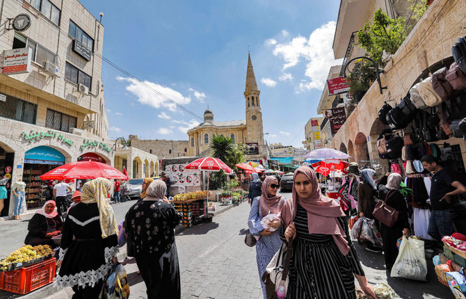 Palestinians shop at a market in the old city of Bethlehem in the occupied West Bank. (AFP file photo)