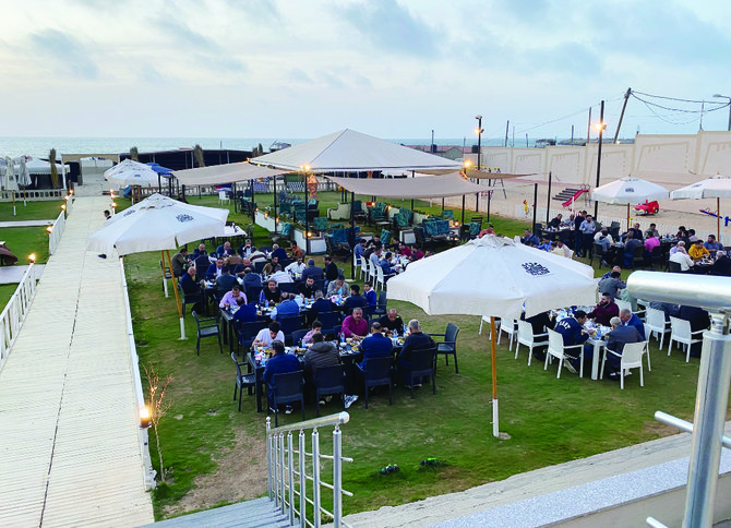 In Gaza, families enjoy iftar on the beach with cool breeze and fantastic view