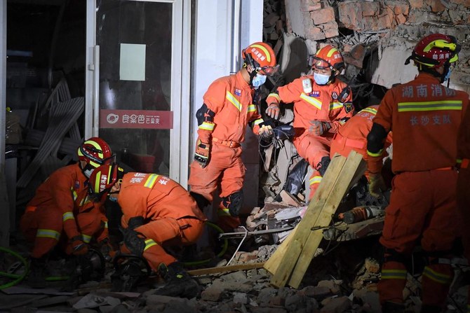 Sixth survivor pulled from China building collapse, dozens still missing