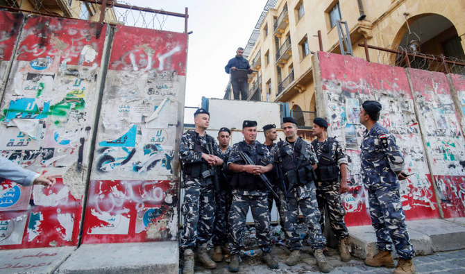 Lebanese police stand guard at the entrance of the Lebanese parliament in Beirut on Monday. (AFP)