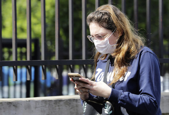 A Lebanese woman checks her phone in the capital Beirut. (AFP file photo)