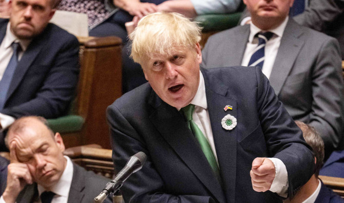 Britain's Prime Minister Boris Johnson gesturing and speaking at the House of Commons in London on July 13, 2022. (AFP)
