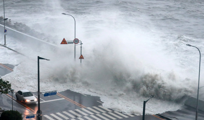 A wave caused by Typhoon Hinnamnor hits the waterfront in Busan, South Korea, September 6, 2022. (REUTERS)