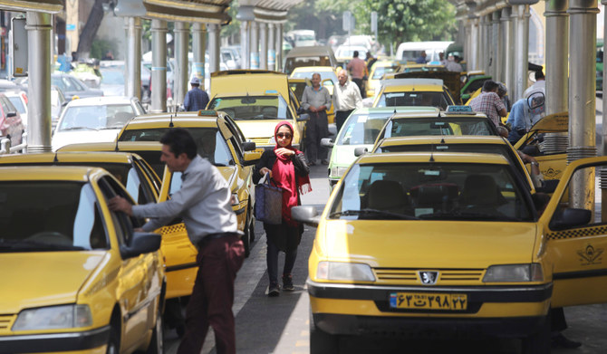 Taxis line up to pick up customers at a taxi station in the Iranian capital Tehran. (AFP file photo)