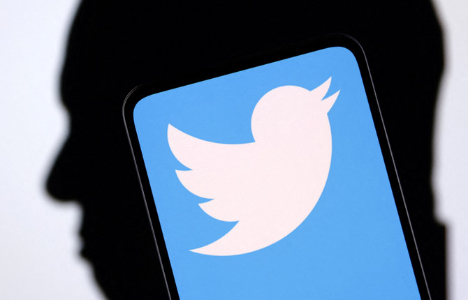 Twitter logo and Elon Musk silhouette are seen in this illustration taken, December 19, 2022. (REUTERS)