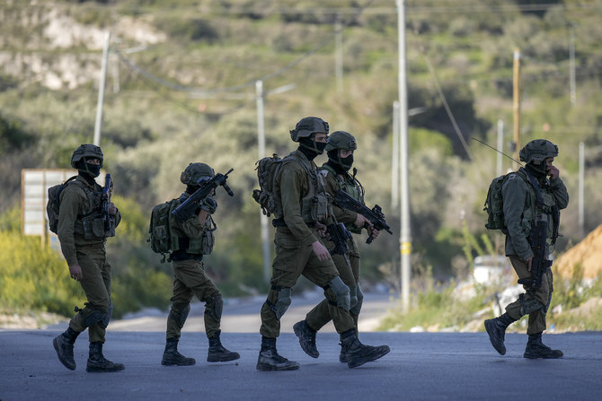 Israeli soldiers operate in village of Sarra near the Palestinians West Bank city of Nablus, Sunday, March 12, 2023. (AP)