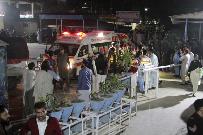 Rescue worker unload earthquake victims from an ambulance at a hospital in Saidu Sharif, a town Pakistan's Swat valley, Tuesday,