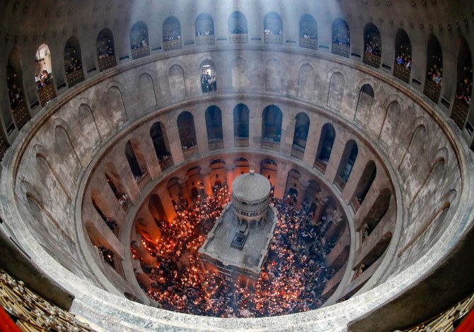 Christian faithful flock to ‘Holy Fire’ under restrictions